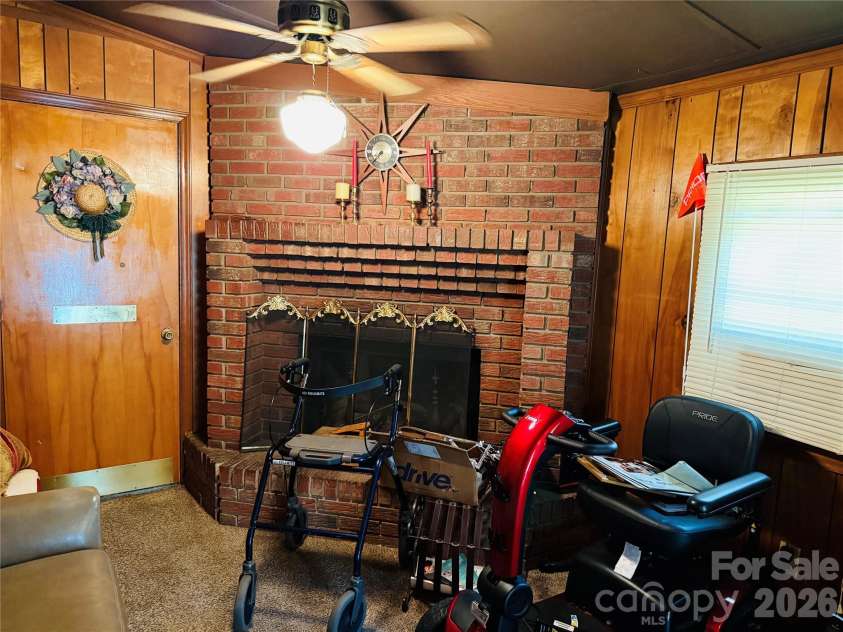 4410 Birkdale Drive, Charlotte, NC 28208.  MLS# CAR4392770, YatesRealty ID 31186. Brick Fireplace in Den