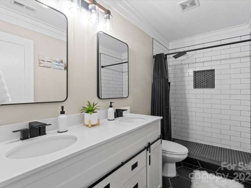 402 Wildlife Road, Troutman, NC 28166.  MLS# CAR4272681, YatesRealty ID 31205. Downstairs bathroom
