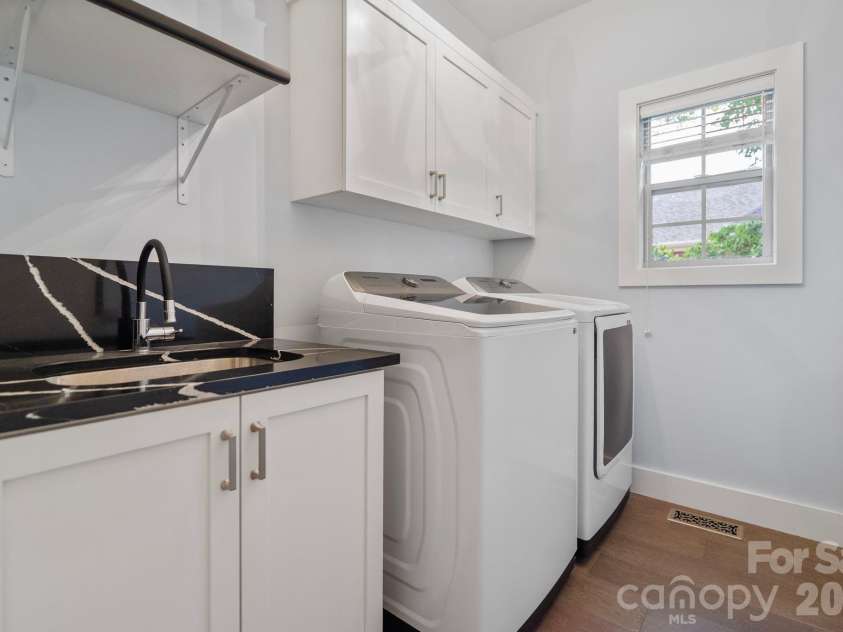 526 Ballymote Court, Matthews, NC 28104.  MLS# CAR4388258, YatesRealty ID 31207. Laundry Room – Conveniently located laundry room with dedicated workspace and storage potential to help keep household tasks organized and efficient.