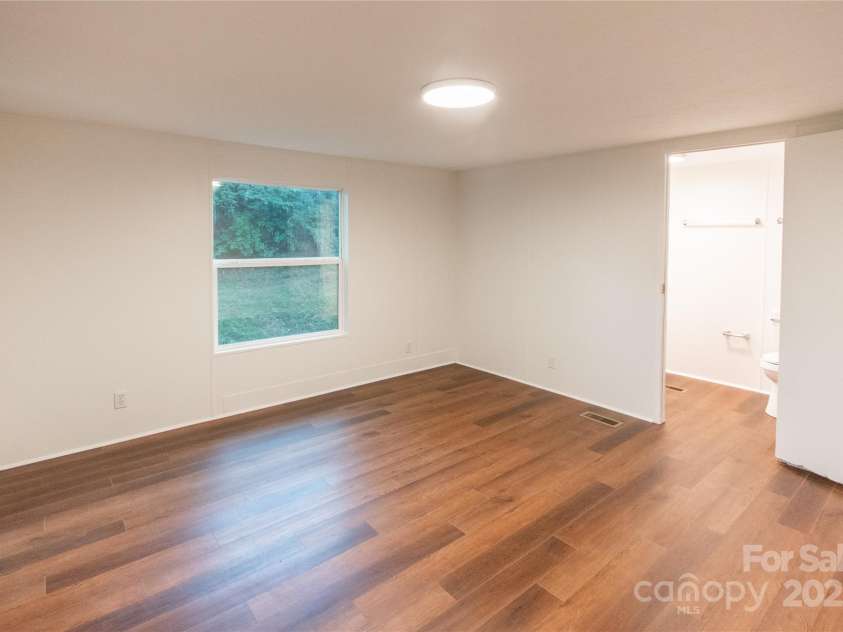 40 Pat Rogers Road, Franklin, NC 28734.  MLS# CAR4282169, YatesRealty ID 31209. Primary bedroom