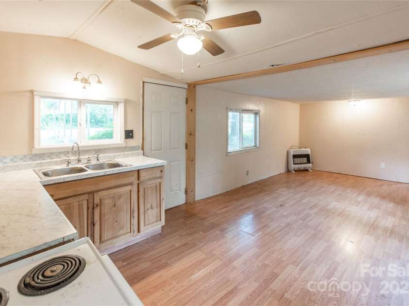 36 & 40 Pat Rogers Road, Franklin, NC 28734.  MLS# CAR4282191, YatesRealty ID 31210. Second Home kitchen to living area