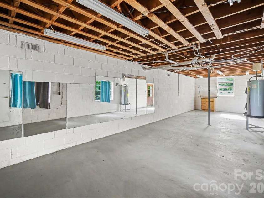 1003 Sumter Street, Shelby, NC 28150.  MLS# CAR4394841, YatesRealty ID 31211. Basement workshop view 2