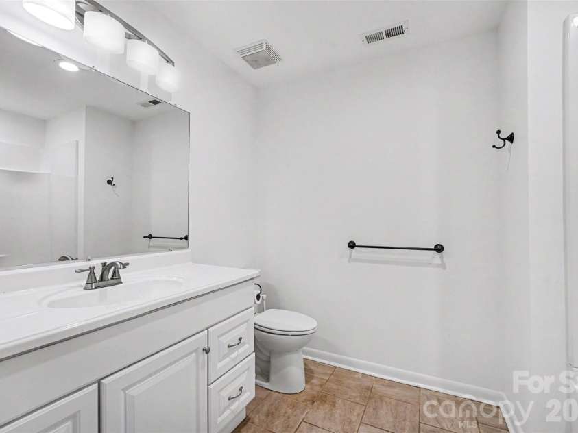 1003 Sumter Street, Shelby, NC 28150.  MLS# CAR4394841, YatesRealty ID 31211. Hall bathroom