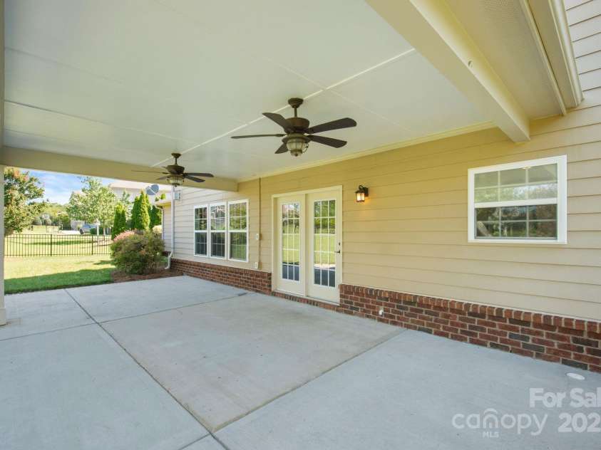 16010 Loch Raven Road, Huntersville, NC 28078.  MLS# CAR4277329, YatesRealty ID 31214. Patio features dual ceiling fans making outdoor gatherings cool and comfortable