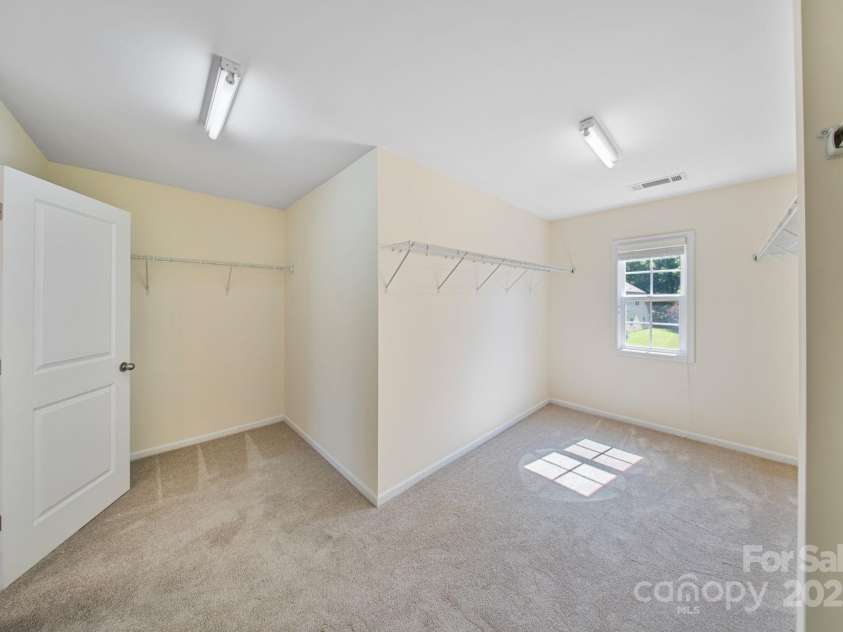 16010 Loch Raven Road, Huntersville, NC 28078.  MLS# CAR4277329, YatesRealty ID 31214. Sizeable primary suite closet allows room for ample belongings and storage.
