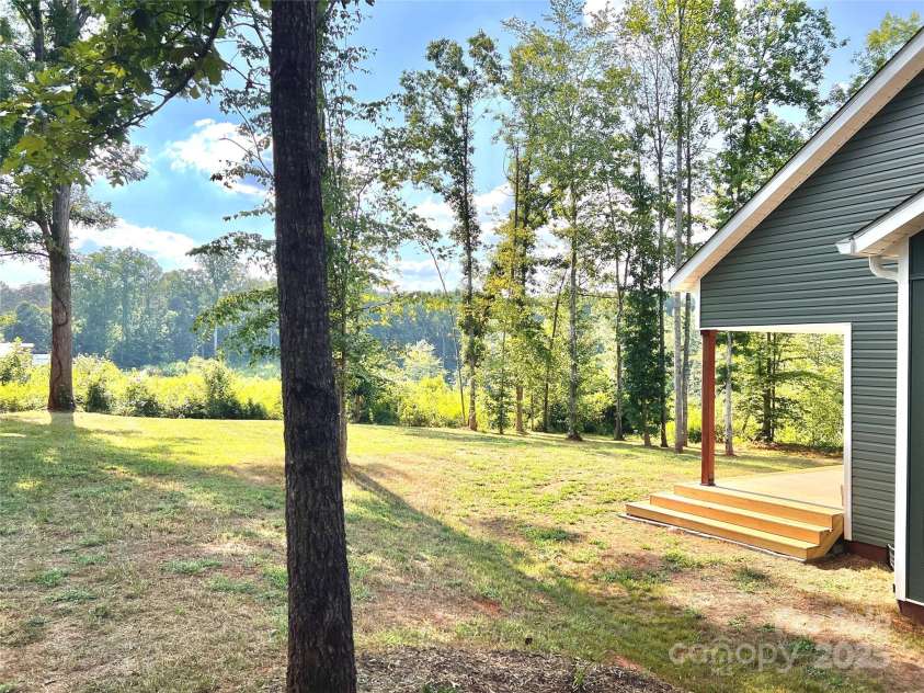 123 Arrowood Lane, Harmony, NC 28634.  MLS# CAR4285616, YatesRealty ID 31220. Side yard