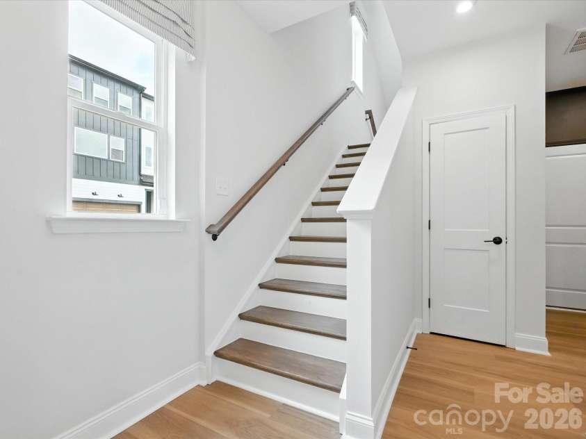 7937 Cedarsmith Court, Charlotte, NC 28217.  MLS# CAR4395047, YatesRealty ID 31235. First floor oak box stairs