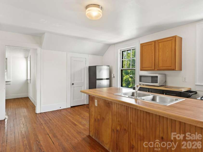 102 Courtland Avenue, Asheville, NC 28801.  MLS# CAR4390335, YatesRealty ID 31240. Kitchen with Large Pantry