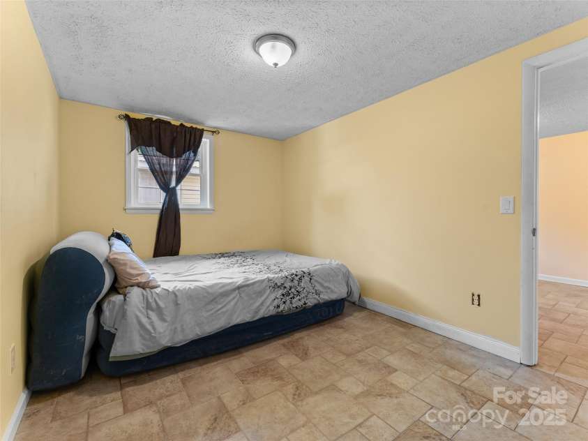 5 Granite Drive, Hendersonville, NC 28792.  MLS# CAR4266478, YatesRealty ID 31249. Downstairs bedroom.