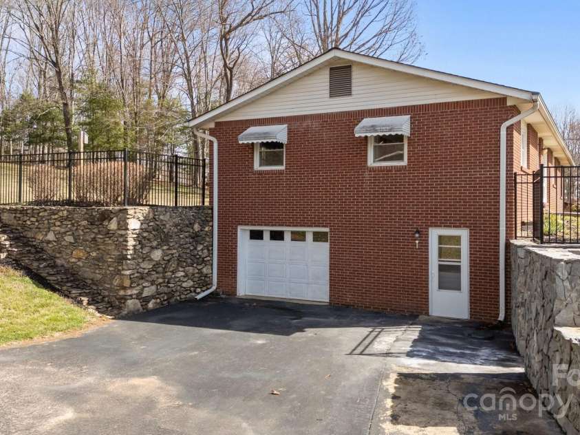 100 Young Drive, Candler, NC 28715.  MLS# CAR4230745, YatesRealty ID 3125. Drive in basement