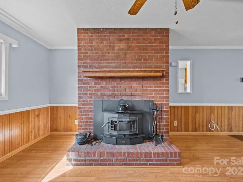 100 Young Drive, Candler, NC 28715.  MLS# CAR4230745, YatesRealty ID 3125. Functioning wood stove