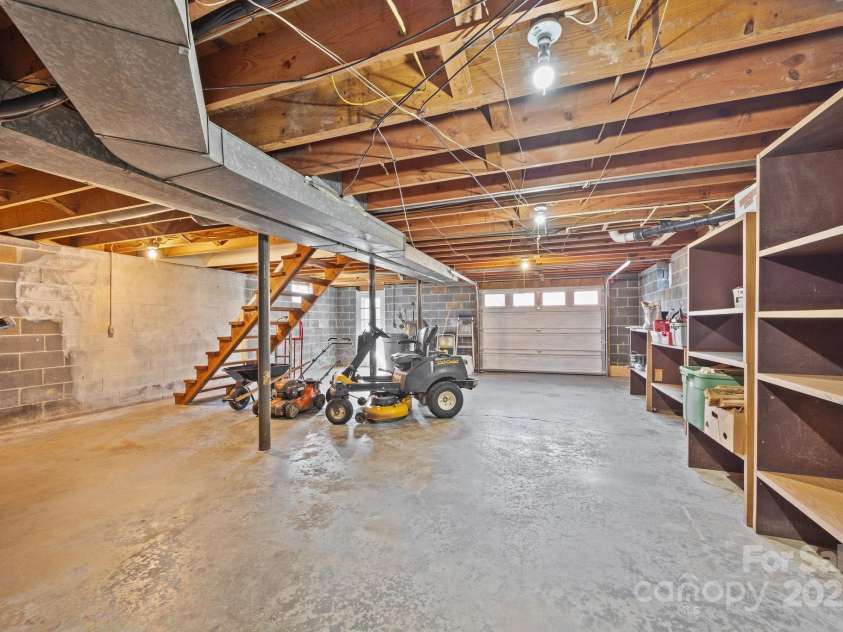 100 Young Drive, Candler, NC 28715.  MLS# CAR4230745, YatesRealty ID 3125. Large bright and dry basement