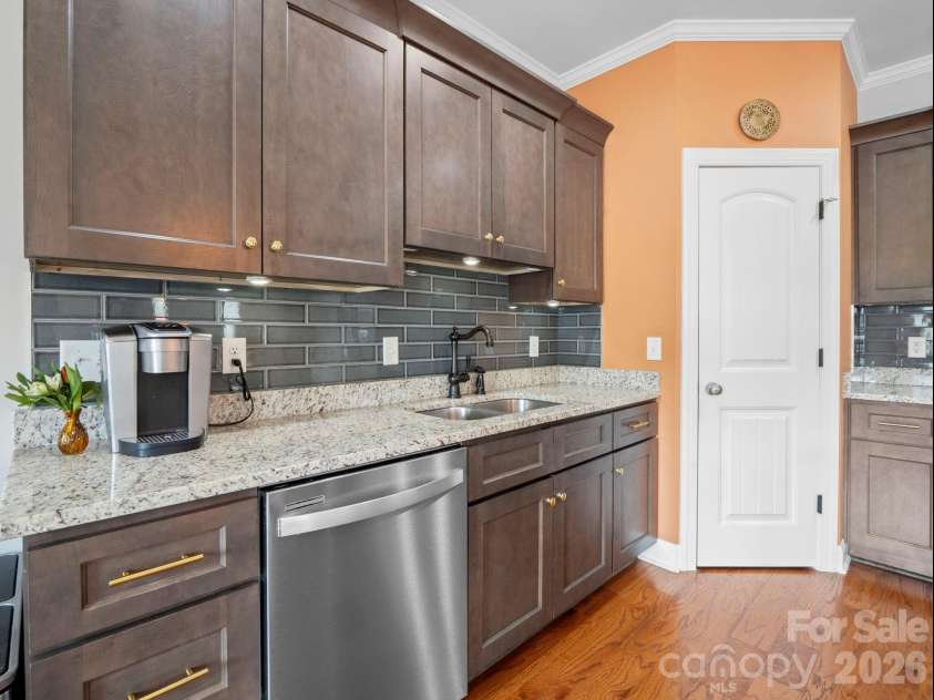 614 Downing Way, Landrum, SC 29356.  MLS# CAR4349559, YatesRealty ID 3125. Custom kitchen backsplash and upgraded faucet