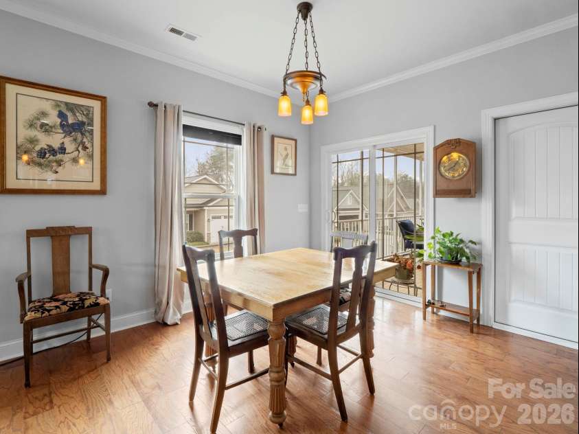 614 Downing Way, Landrum, SC 29356.  MLS# CAR4349559, YatesRealty ID 3125. Dining area opens to a screen porch for added dining options.
