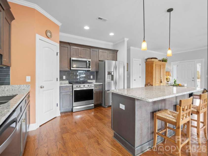 614 Downing Way, Landrum, SC 29356.  MLS# CAR4349559, YatesRealty ID 3125. Door on the left leads to a pantry with custom a shelving system