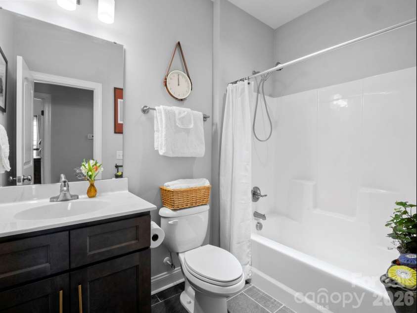 614 Downing Way, Landrum, SC 29356.  MLS# CAR4349559, YatesRealty ID 3125. Guest bathroom with tile floors