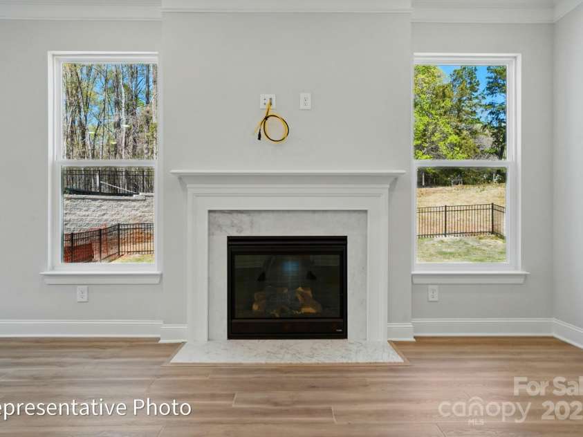 155 Prestwick Way, Mooresville, NC 28115.  MLS# CAR4286540, YatesRealty ID 31252. This home has a gas fireplace with marble surround