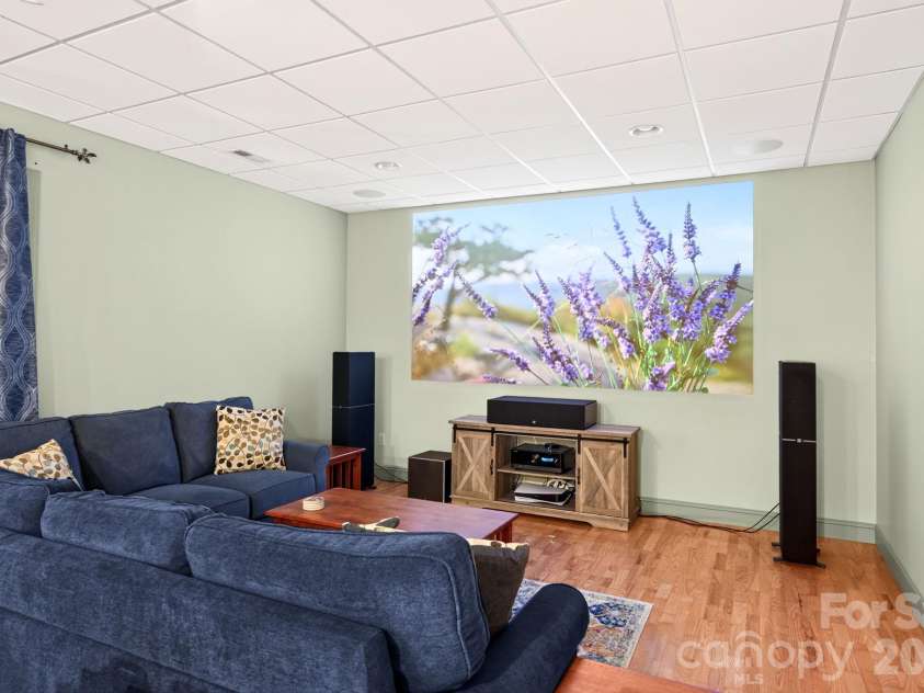25 Whitaker View Road, Fairview, NC 28730.  MLS# CAR4394888, YatesRealty ID 31252. Basement Den Projector Conveys