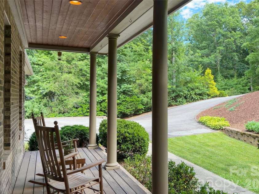 25 Whitaker View Road, Fairview, NC 28730.  MLS# CAR4394888, YatesRealty ID 31252. Covered Front Porch for Quiet Mornings