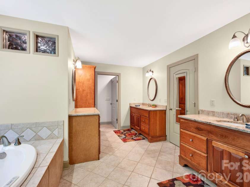 25 Whitaker View Road, Fairview, NC 28730.  MLS# CAR4394888, YatesRealty ID 31252. Spacious Primary Ensuite Bath