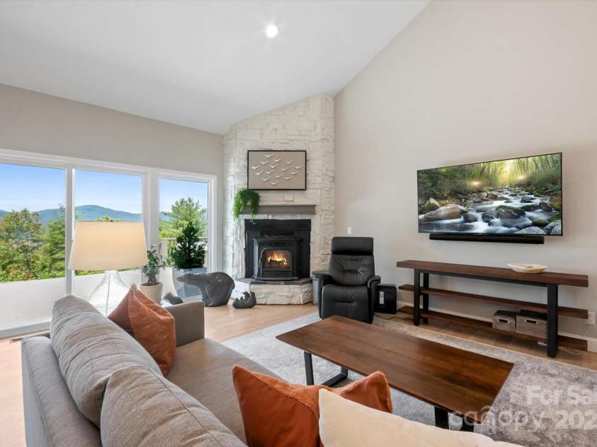 225 Calm Creek Road, Fletcher, NC 28732.  MLS# CAR4275540, YatesRealty ID 31254. Pellet stove adds ambiance.