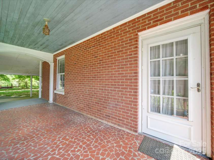 5237 NC Highway 90 E Highway, Hiddenite, NC 28636.  MLS# CAR4143514, YatesRealty ID 3126. Terracotta Floored Covered Side Porch!