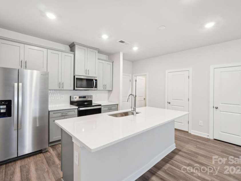 115 Ciara Place, Mooresville, NC 28117.  MLS# CAR4198397, YatesRealty ID 31265. Photo is not of the actual home, but is an inspirational photo of builder’s model home and may depict options, furnishings, and/or decorator features that are not included