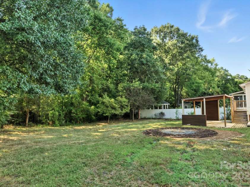 9003 Steelechase Drive, Charlotte, NC 28273.  MLS# CAR4288220, YatesRealty ID 31275. Spacious and Level Corner Lot lined with mature trees!