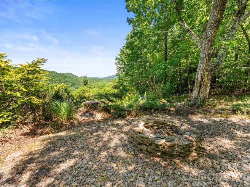 350 Winding Ridge Road, Black Mountain, NC 28711.  MLS# CAR4391914, YatesRealty ID 31277. Fire pit with a view in the gardens area
