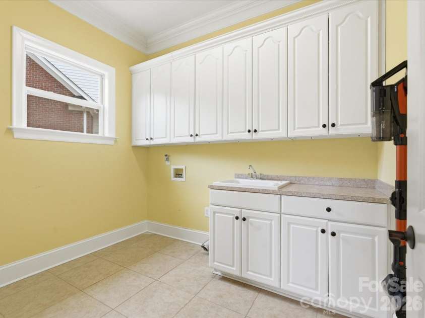 458 Inverness Place, Rock Hill, SC 29730.  MLS# CAR4352853, YatesRealty ID 31282. Large laundry room with ample storage