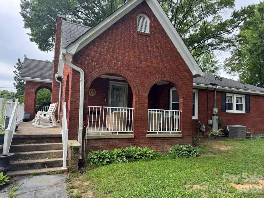 1303 Lane Street, Kannapolis, NC 28083.  MLS# CAR4390357, YatesRealty ID 31285. Side porch with steps to back yard