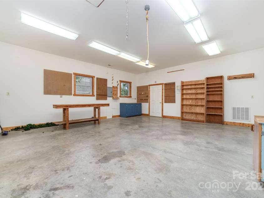 415 Greenbriar Road, Statesville, NC 28625.  MLS# CAR4288246, YatesRealty ID 31286. Large workshop in outbuilding. Space for woodworking equipment shop, man cave, etc.