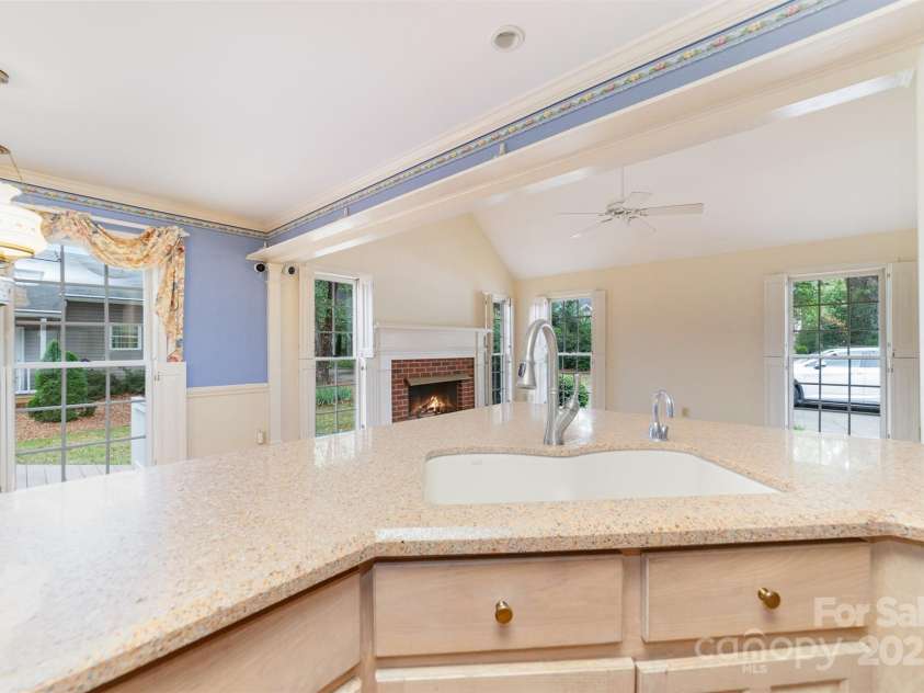 415 Greenbriar Road, Statesville, NC 28625.  MLS# CAR4288246, YatesRealty ID 31286. Looking from Kitchen into Den and Breakfast area.