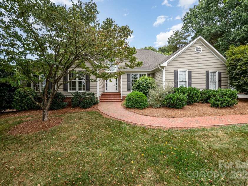 415 Greenbriar Road, Statesville, NC 28625.  MLS# CAR4288246, YatesRealty ID 31286. Lovely brick walkway to front entrance from concrete driveway.
