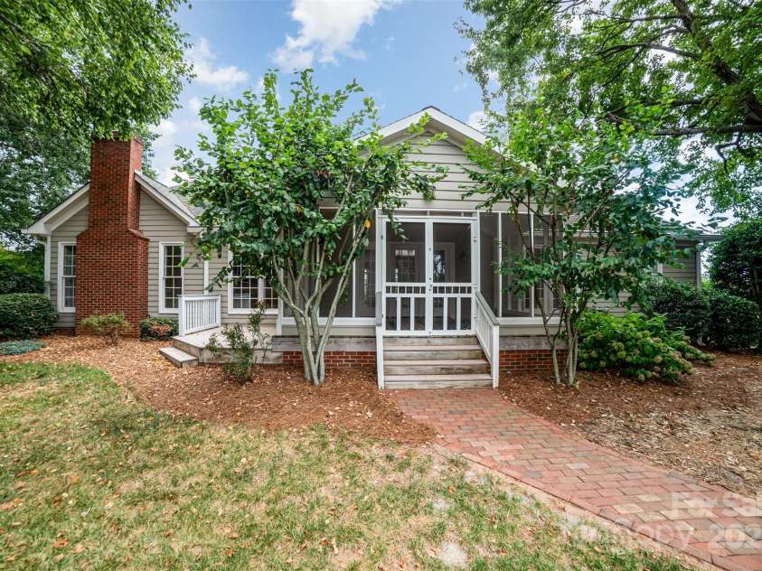 415 Greenbriar Road, Statesville, NC 28625.  MLS# CAR4288246, YatesRealty ID 31286. View of back of home with large screen porch for relaxing or entertaining.