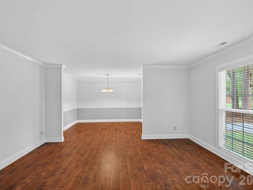 7148 Powder Mill Place, Charlotte, NC 28277.  MLS# CAR4379444, YatesRealty ID 31287. This front room flows into the dining room