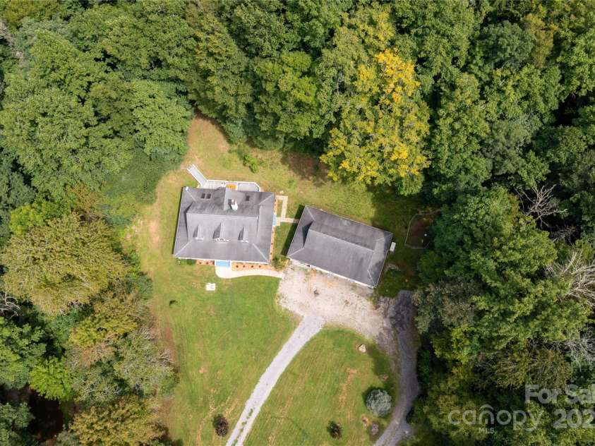 226 Wildcat Mountain Trail, Sylva, NC 28779.  MLS# CAR4284312, YatesRealty ID 31290. Aerial photo of the home and workshop/garage - notice the circular driveway for ease
