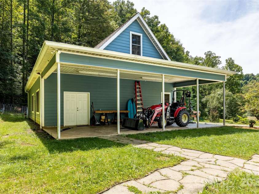226 Wildcat Mountain Trail, Sylva, NC 28779.  MLS# CAR4284312, YatesRealty ID 31290. Covered area connected to the workshop/3-car garage