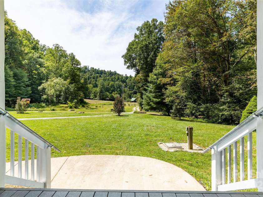 226 Wildcat Mountain Trail, Sylva, NC 28779.  MLS# CAR4284312, YatesRealty ID 31290. Epic view of pasture off the front cover porch