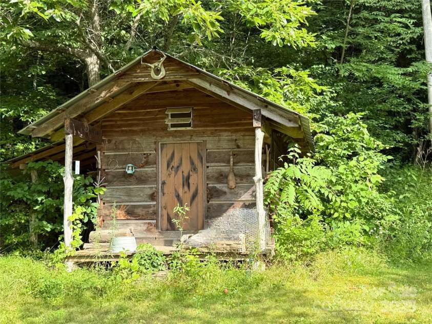 226 Wildcat Mountain Trail, Sylva, NC 28779.  MLS# CAR4284312, YatesRealty ID 31290. Nostalgic mountain cabin for use or storage