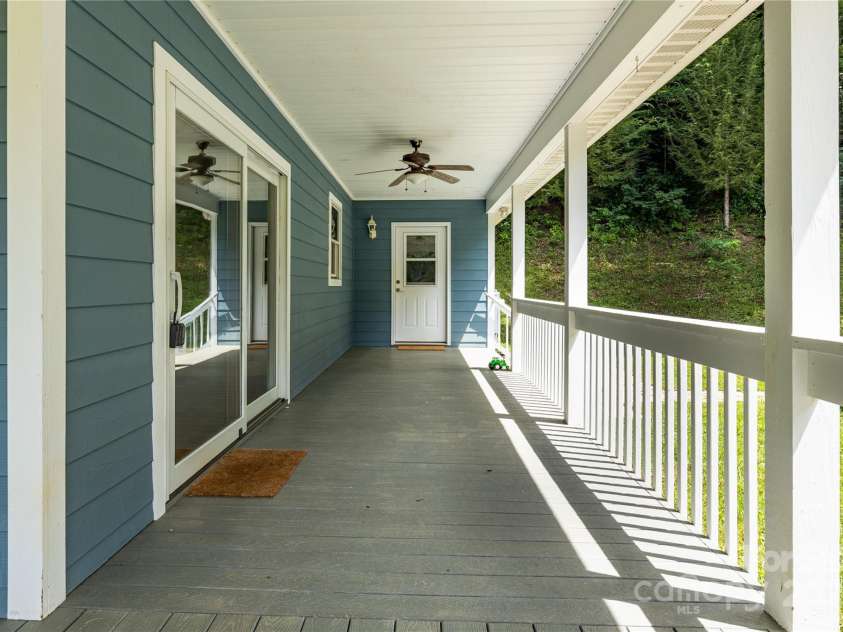 226 Wildcat Mountain Trail, Sylva, NC 28779.  MLS# CAR4284312, YatesRealty ID 31290. Side entrance off the porch leads to mudroom/laundry room
