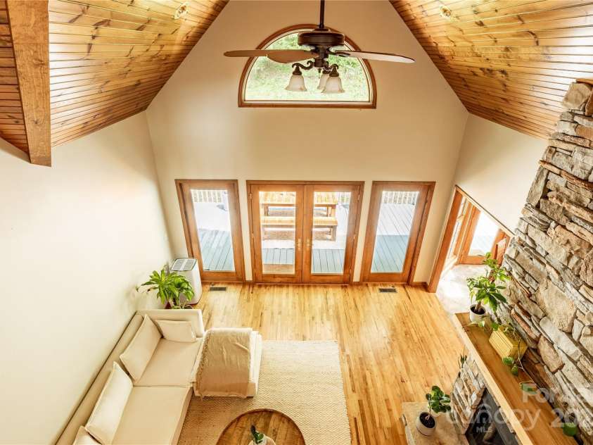 226 Wildcat Mountain Trail, Sylva, NC 28779.  MLS# CAR4284312, YatesRealty ID 31290. View of great room from the upper balcony