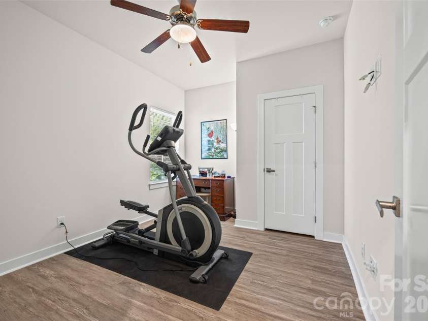 10295 October Glory Way, Charlotte, NC 28215.  MLS# CAR4389910, YatesRealty ID 31295. MAIN LEVEL GUEST SUITE CURRENTLY SERVES AS A HOME GYM