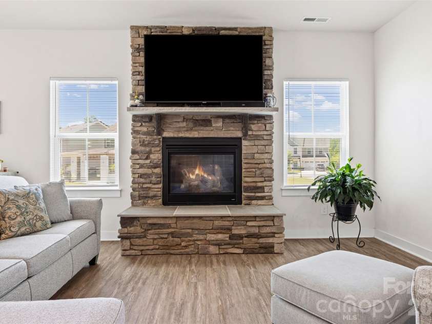 10295 October Glory Way, Charlotte, NC 28215.  MLS# CAR4389910, YatesRealty ID 31295. STACKED STONE FIREPLACE WITH RAISED HEARTH!