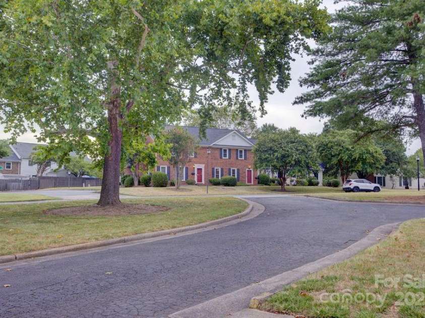 8434 Knights Bridge Road, Charlotte, NC 28210.  MLS# CAR4286331, YatesRealty ID 31301. View of the property from the clubhouse