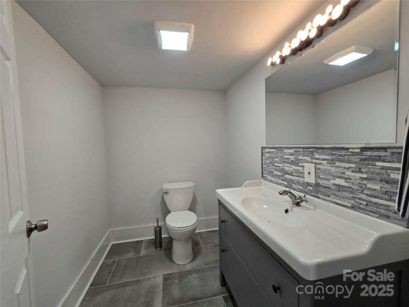 403 Stevens Street, China Grove, NC 28023.  MLS# CAR4281584, YatesRealty ID 31308. 1/2 bath in basement