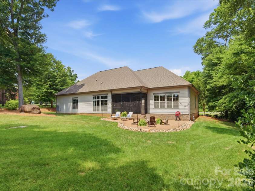 5717 Weddington Road, Concord, NC 28027.  MLS# CAR4394509, YatesRealty ID 31308. Expansive rear private yard with extended patio and firepit.