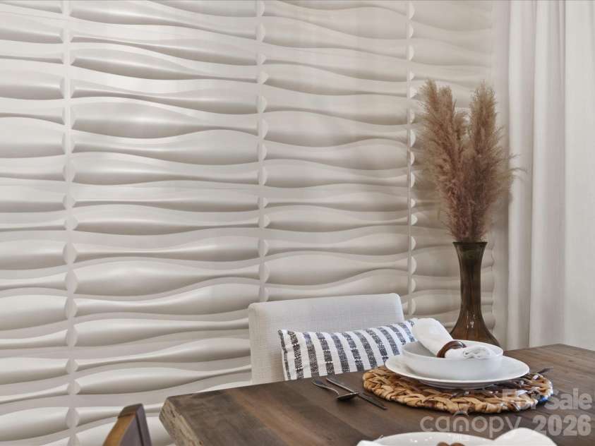 5717 Weddington Road, Concord, NC 28027.  MLS# CAR4394509, YatesRealty ID 31308. Modern art wall enhances your dining experience.