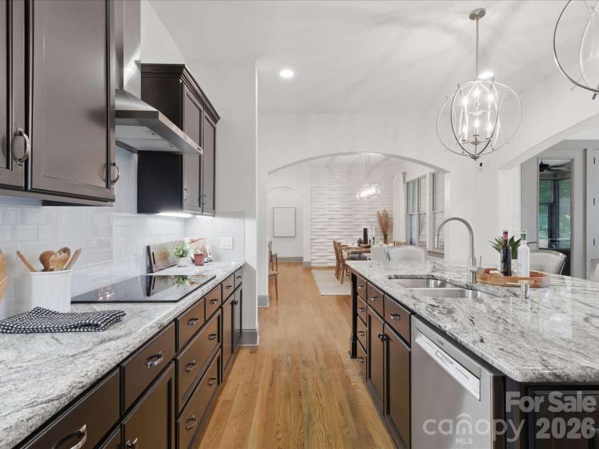 5717 Weddington Road, Concord, NC 28027.  MLS# CAR4394509, YatesRealty ID 31308. Timeless and thoughtfully designed kitchen featuring granite countertops, 42