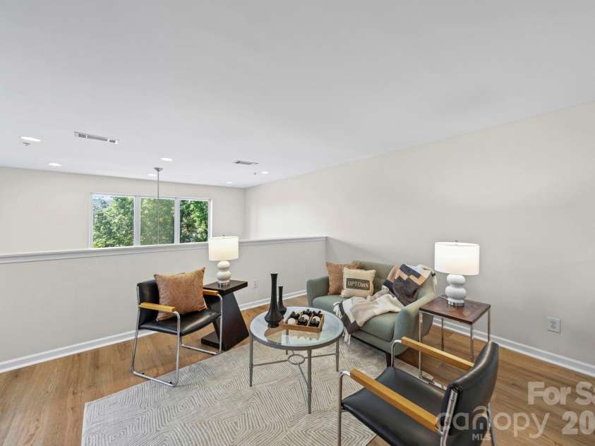 3825 Picasso Court, Charlotte, NC 28205.  MLS# CAR4394154, YatesRealty ID 31314. Loft space for work, entertaining, bring your ideas!
